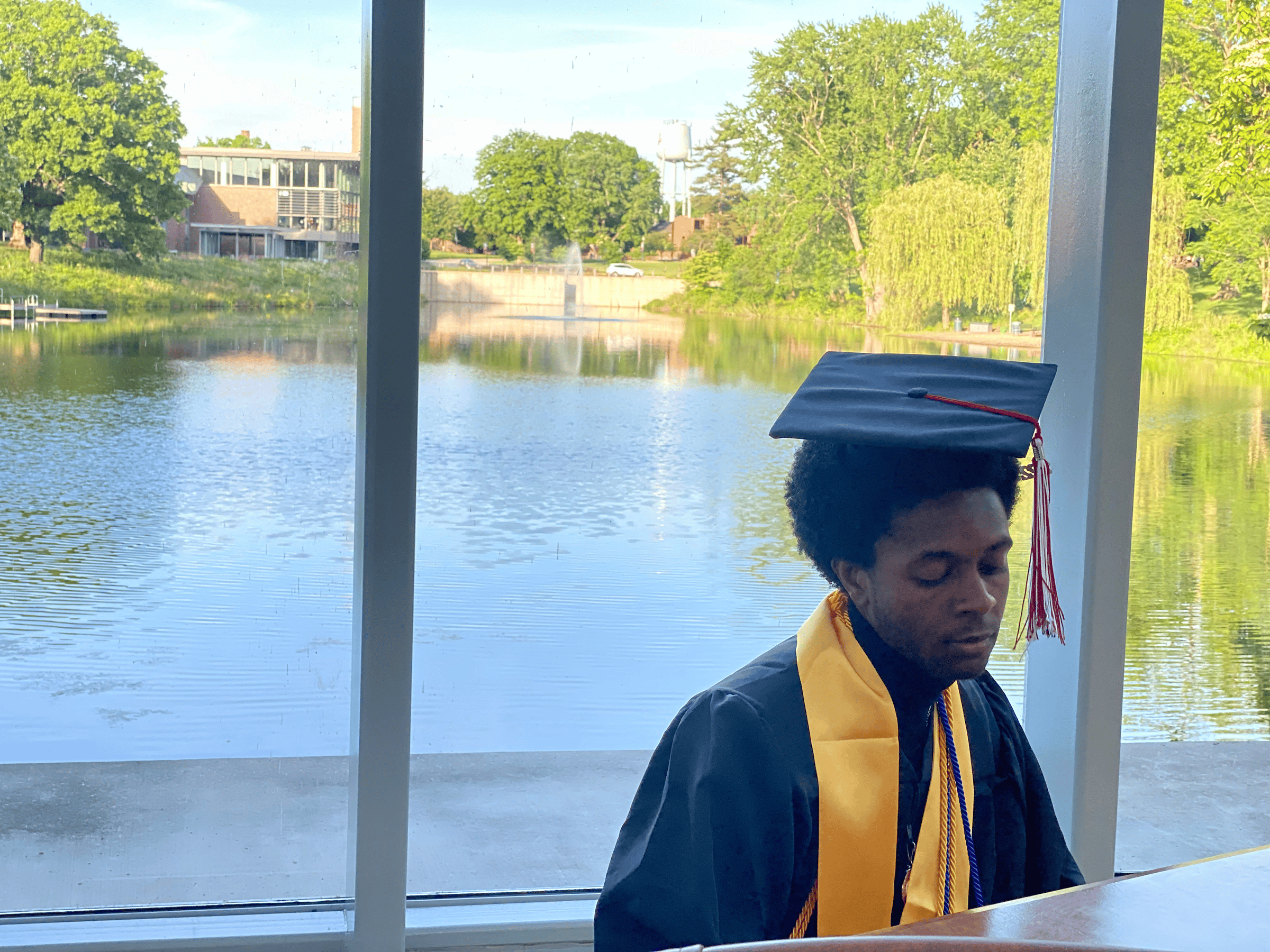 Me playing the piano at Rose-Hulman's White Chapel on graduation day.